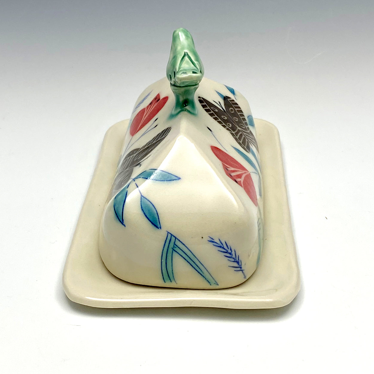 Butter dish with sculpted bird and brown butterflies