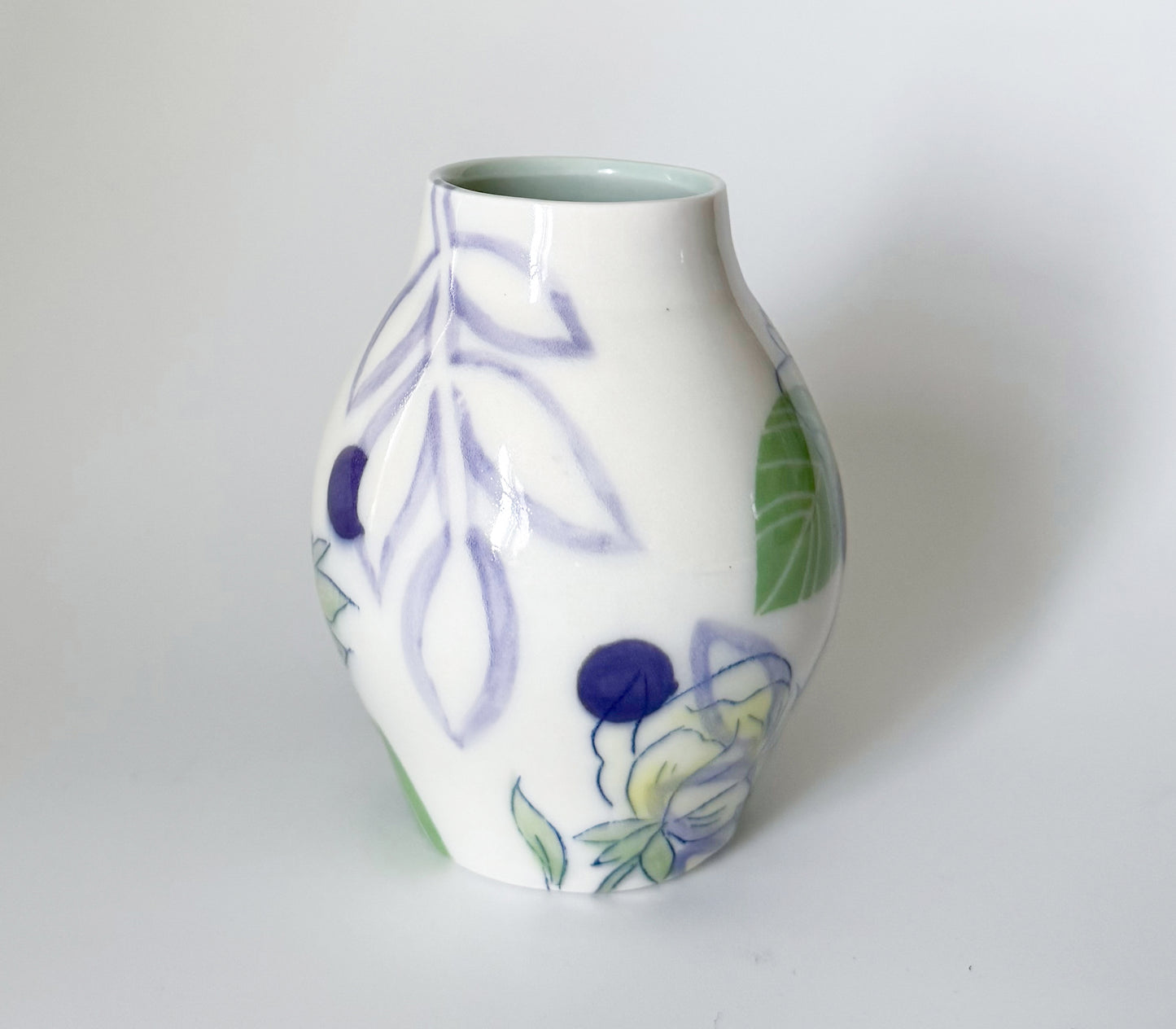Bud vase with yellow flowers