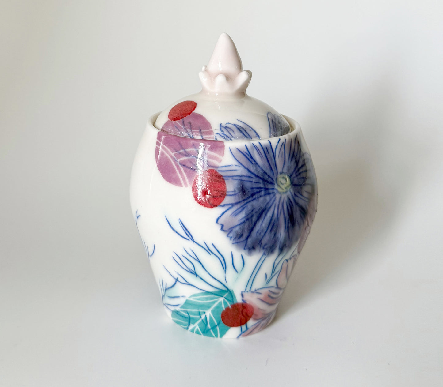 Lidded jar with cosmos flowers