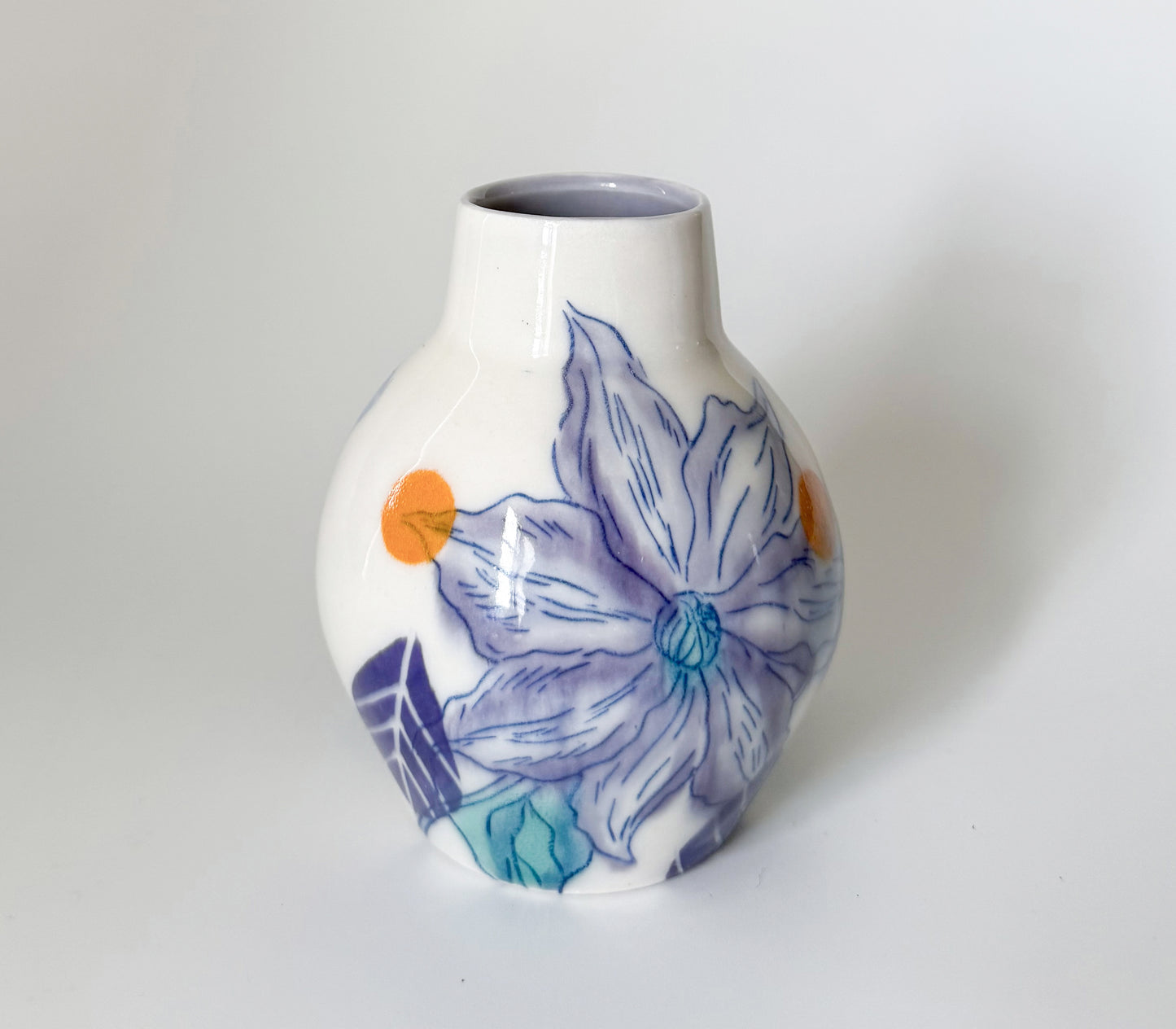 Bud vase with clematis