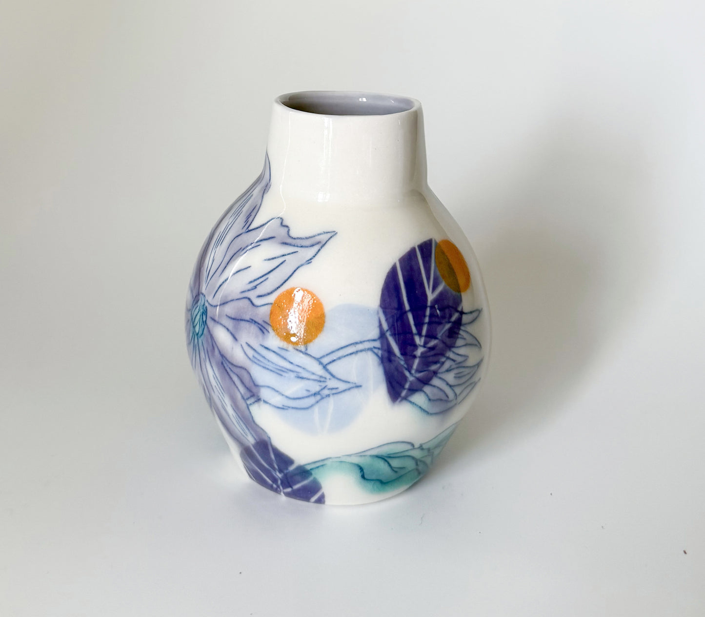 Bud vase with clematis