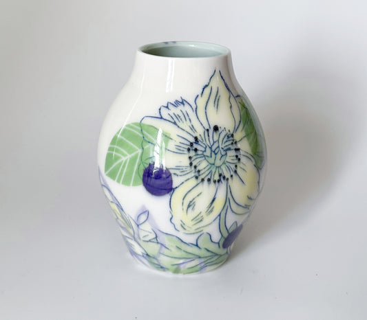 Bud vase with yellow flowers