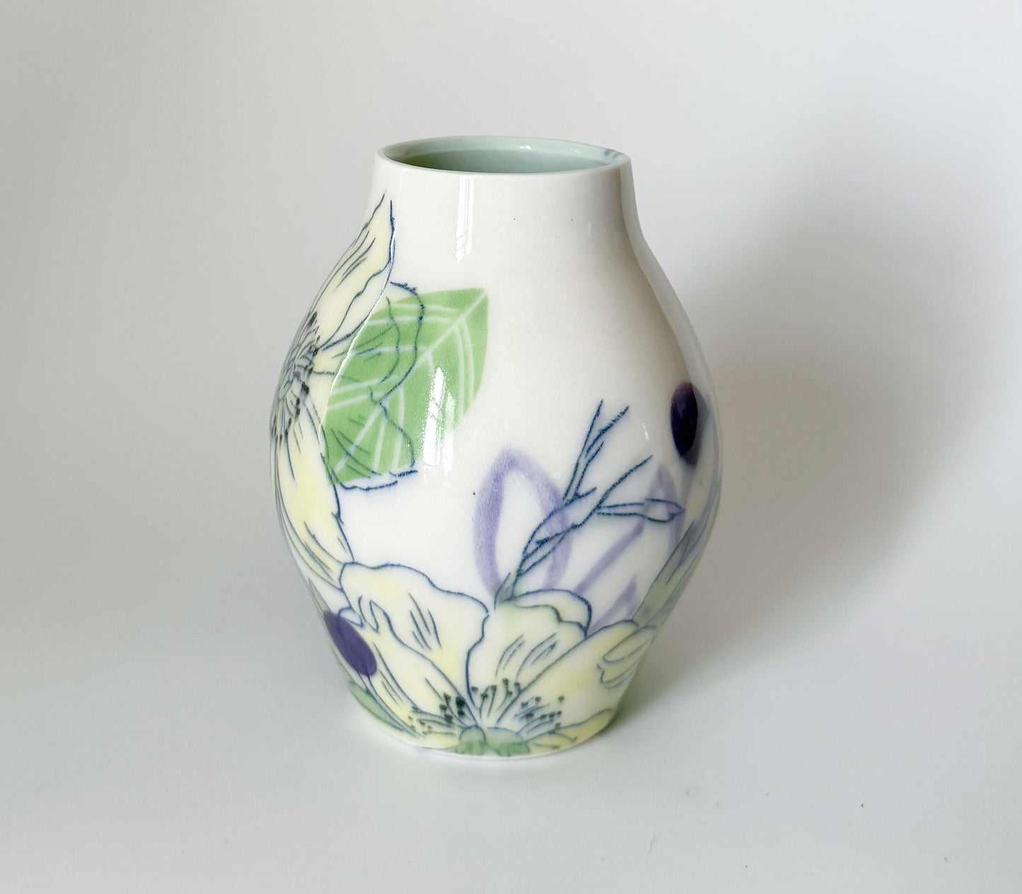 Bud vase with yellow flowers