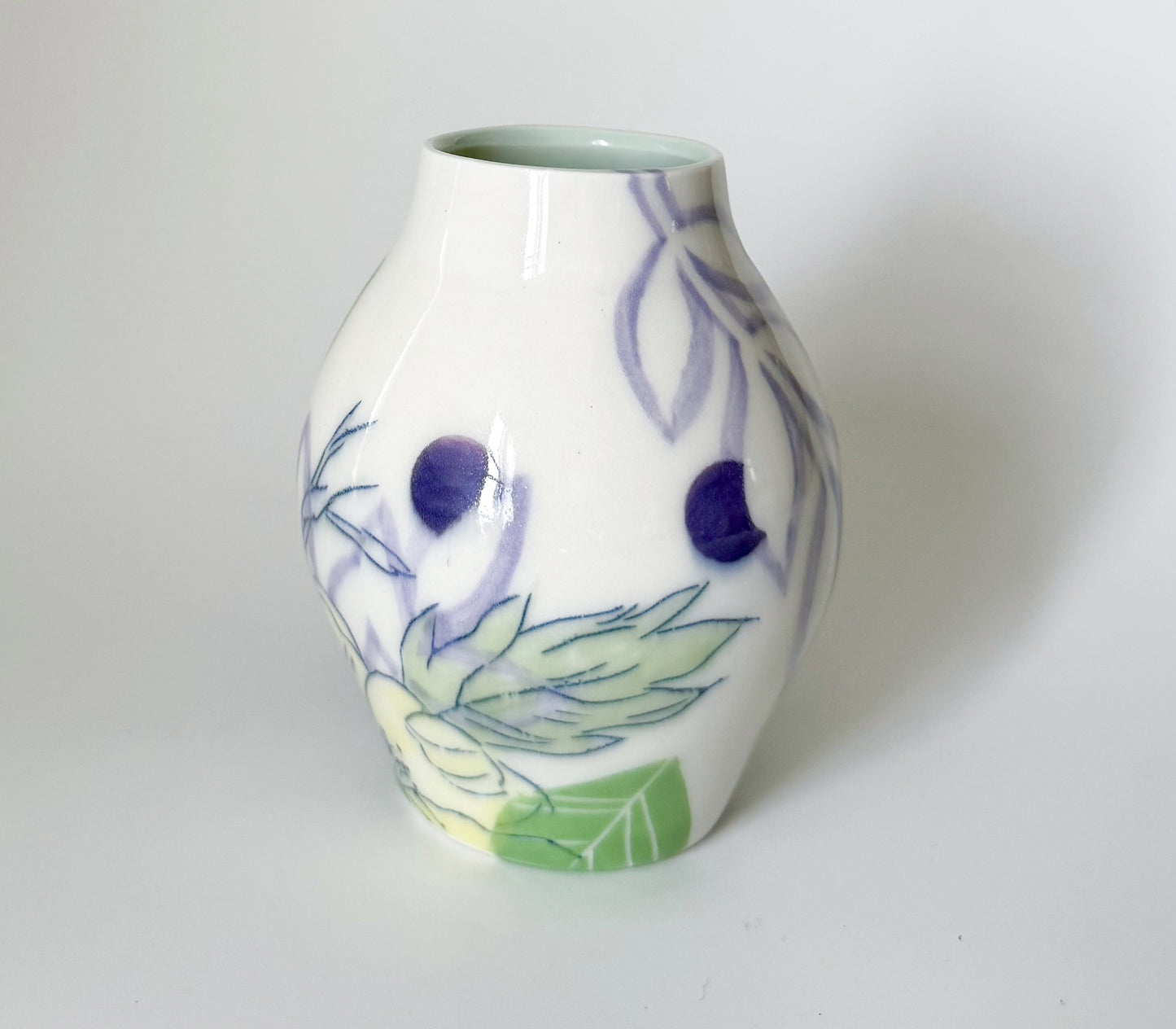 Bud vase with yellow flowers
