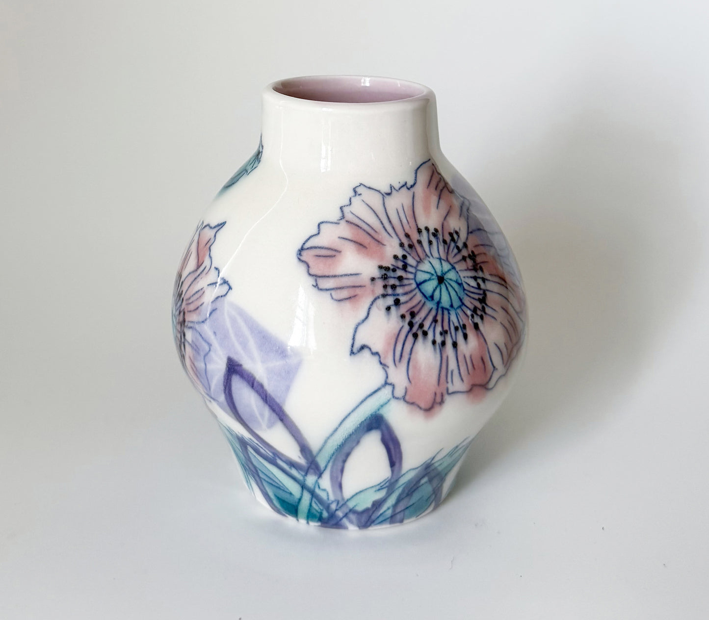 Bud vase with pink poppies