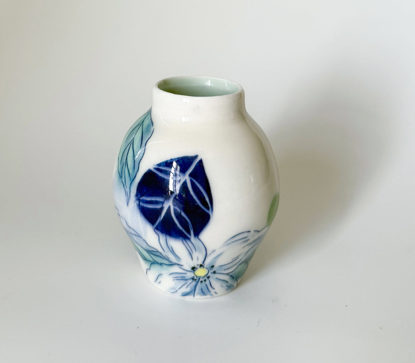 Small bud vase with dogwood blossoms