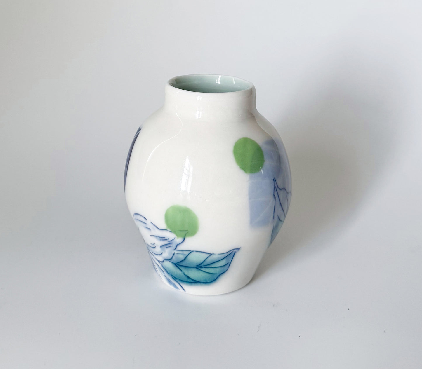 Small bud vase with dogwood blossoms