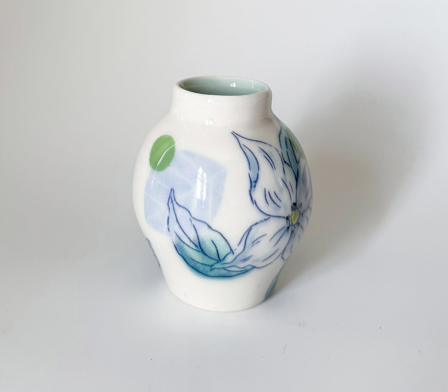 Small bud vase with dogwood blossoms