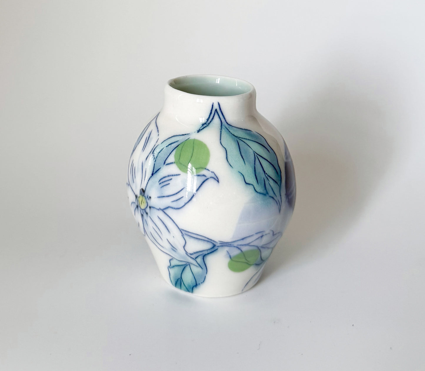 Small bud vase with dogwood blossoms