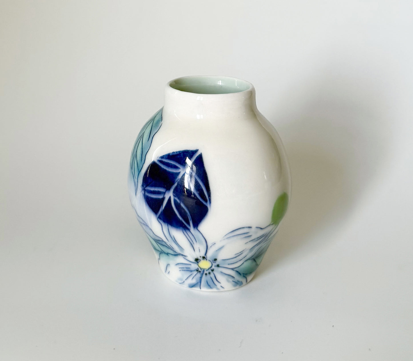 Small bud vase with dogwood blossoms