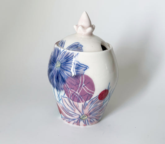 Lidded jar with cosmos flowers