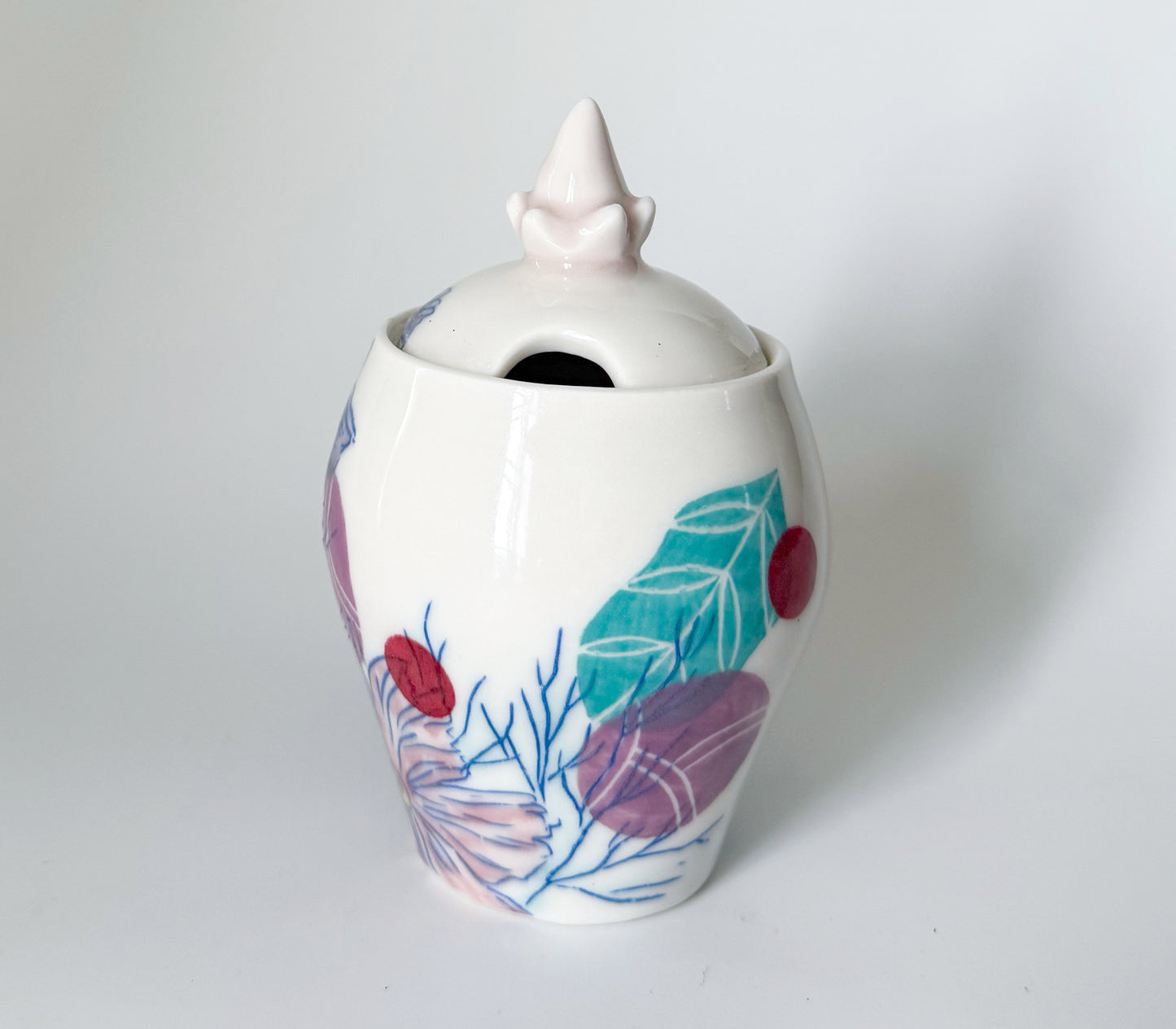 Lidded jar with cosmos flowers