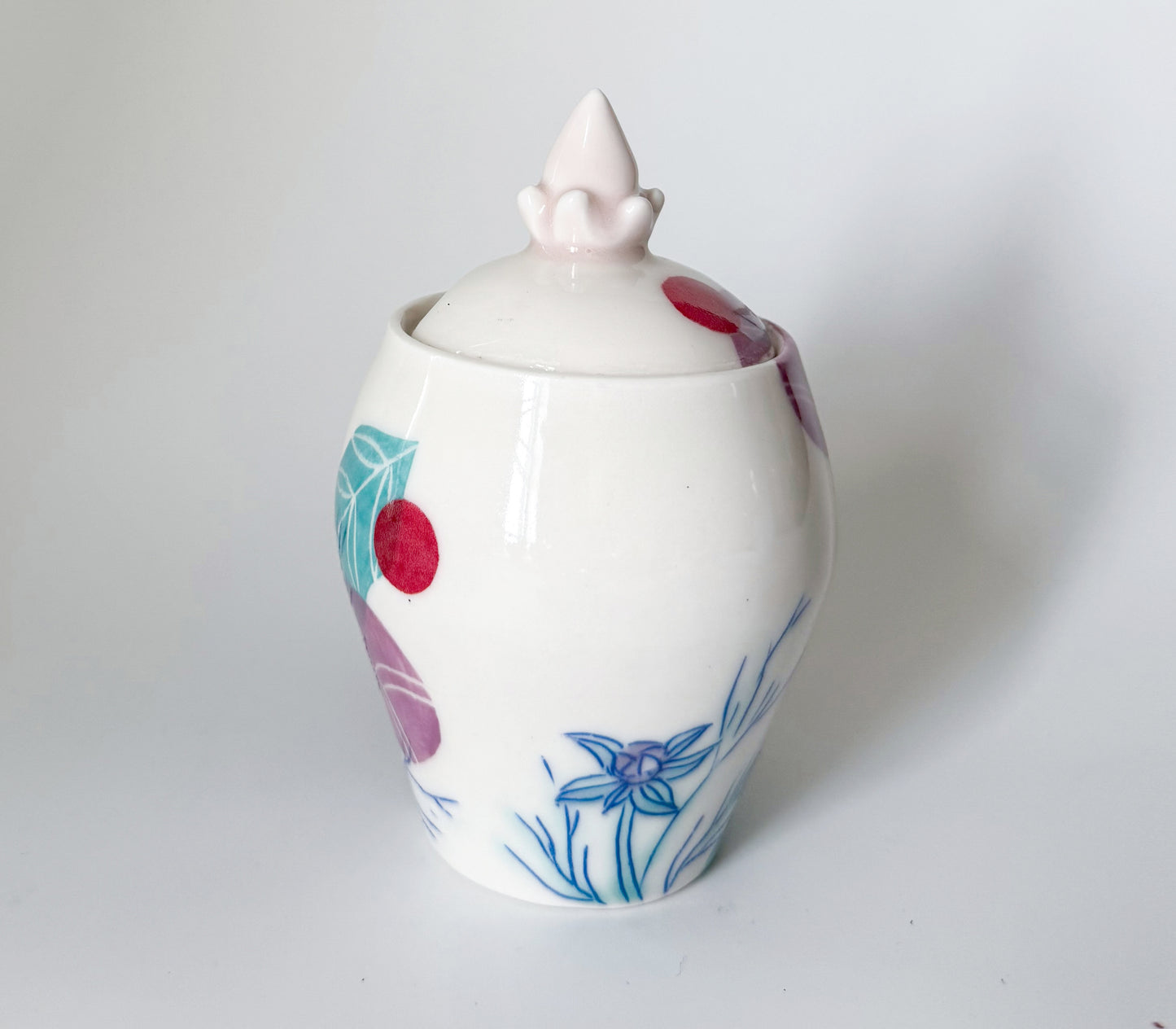 Lidded jar with cosmos flowers