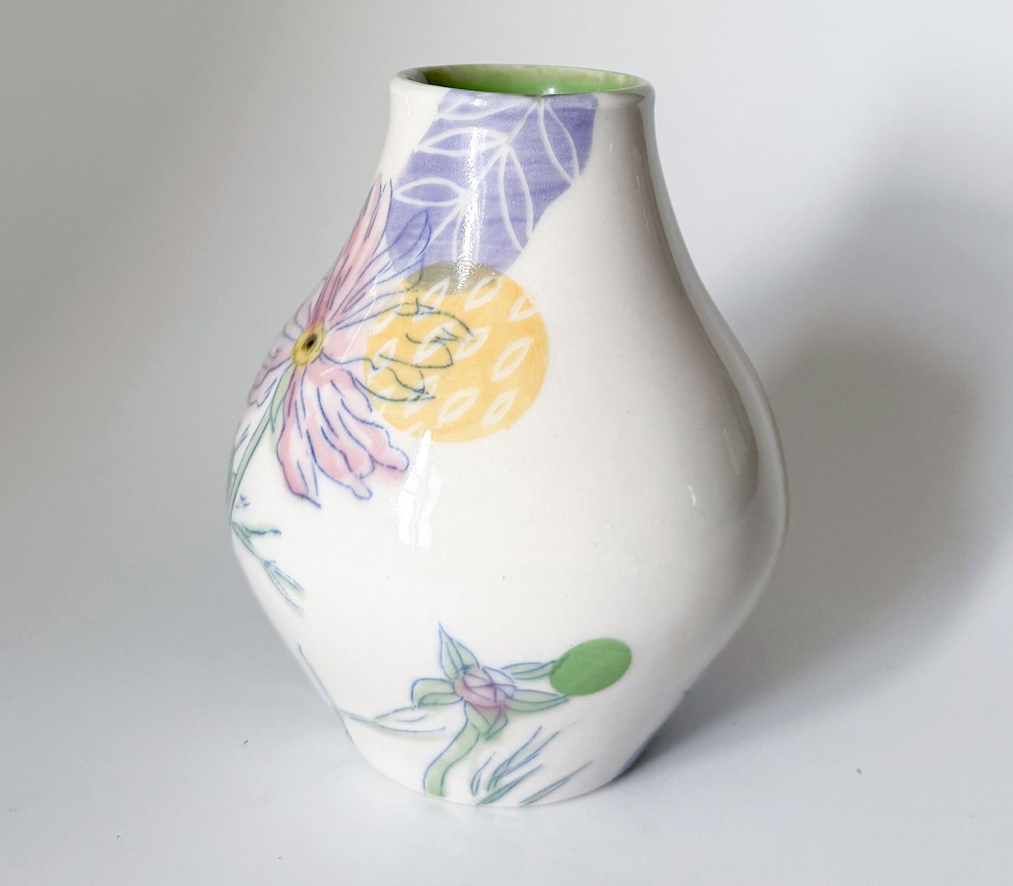 Bud vase with pink cosmos flowers