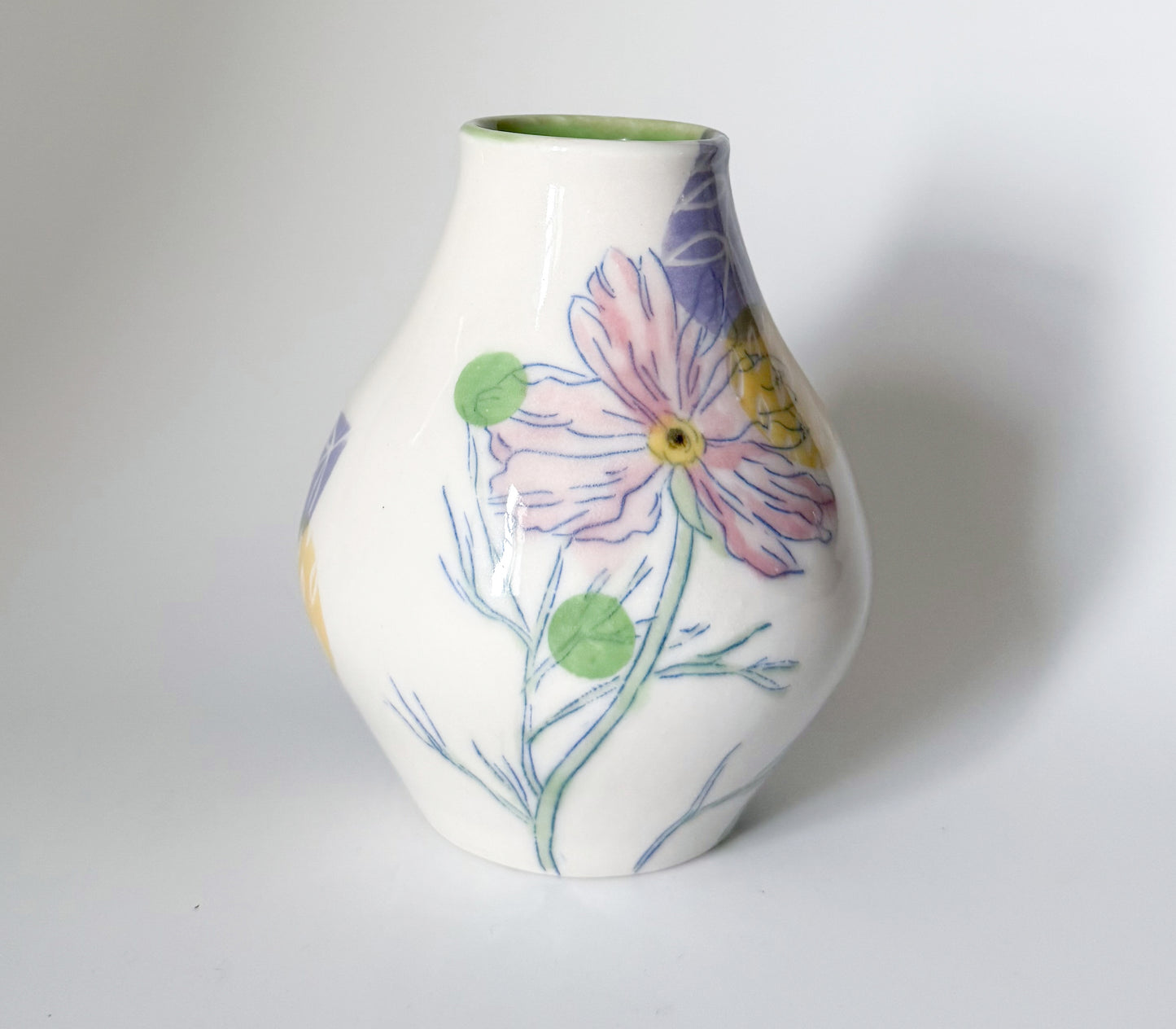 Bud vase with pink cosmos flowers
