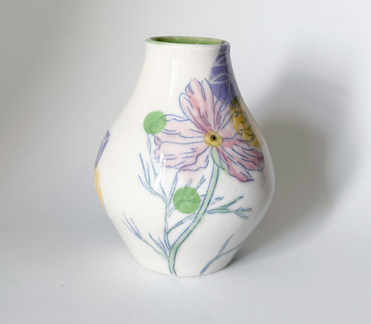 Bud vase with pink cosmos flowers