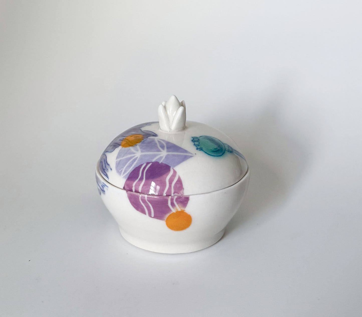 Lidded jar with clematis