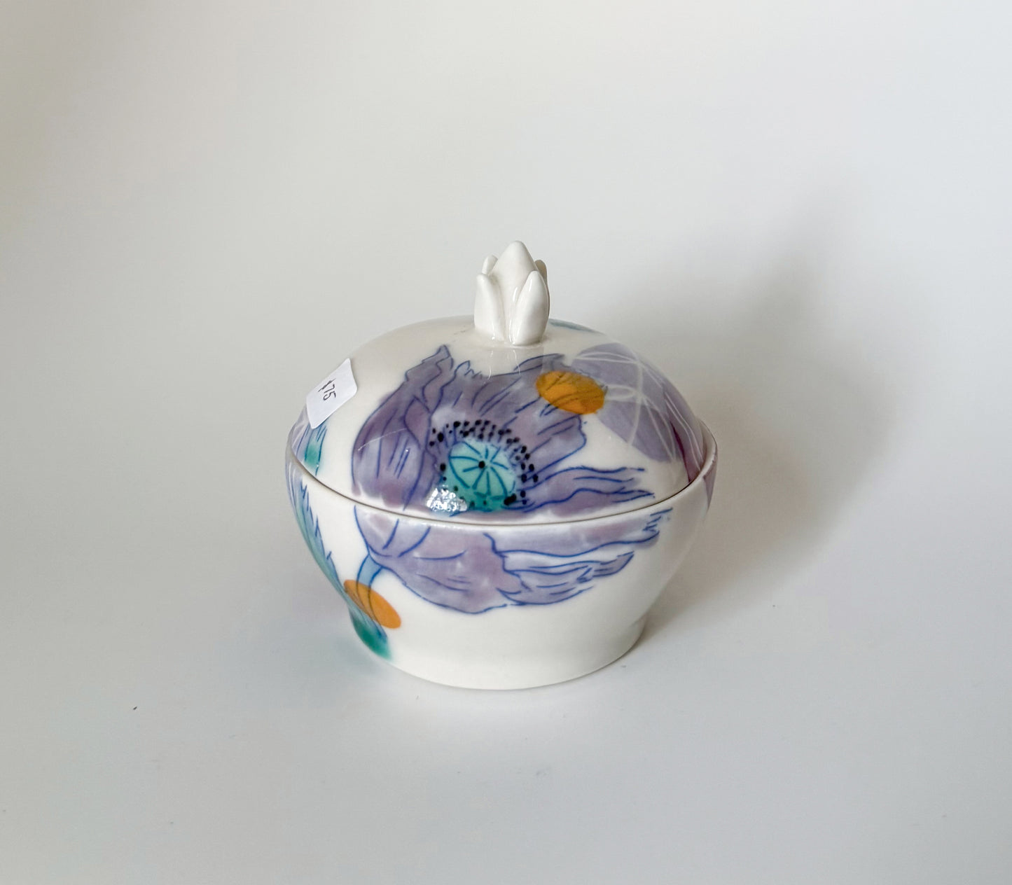 Lidded jar with clematis