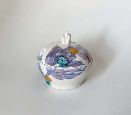 Lidded jar with clematis