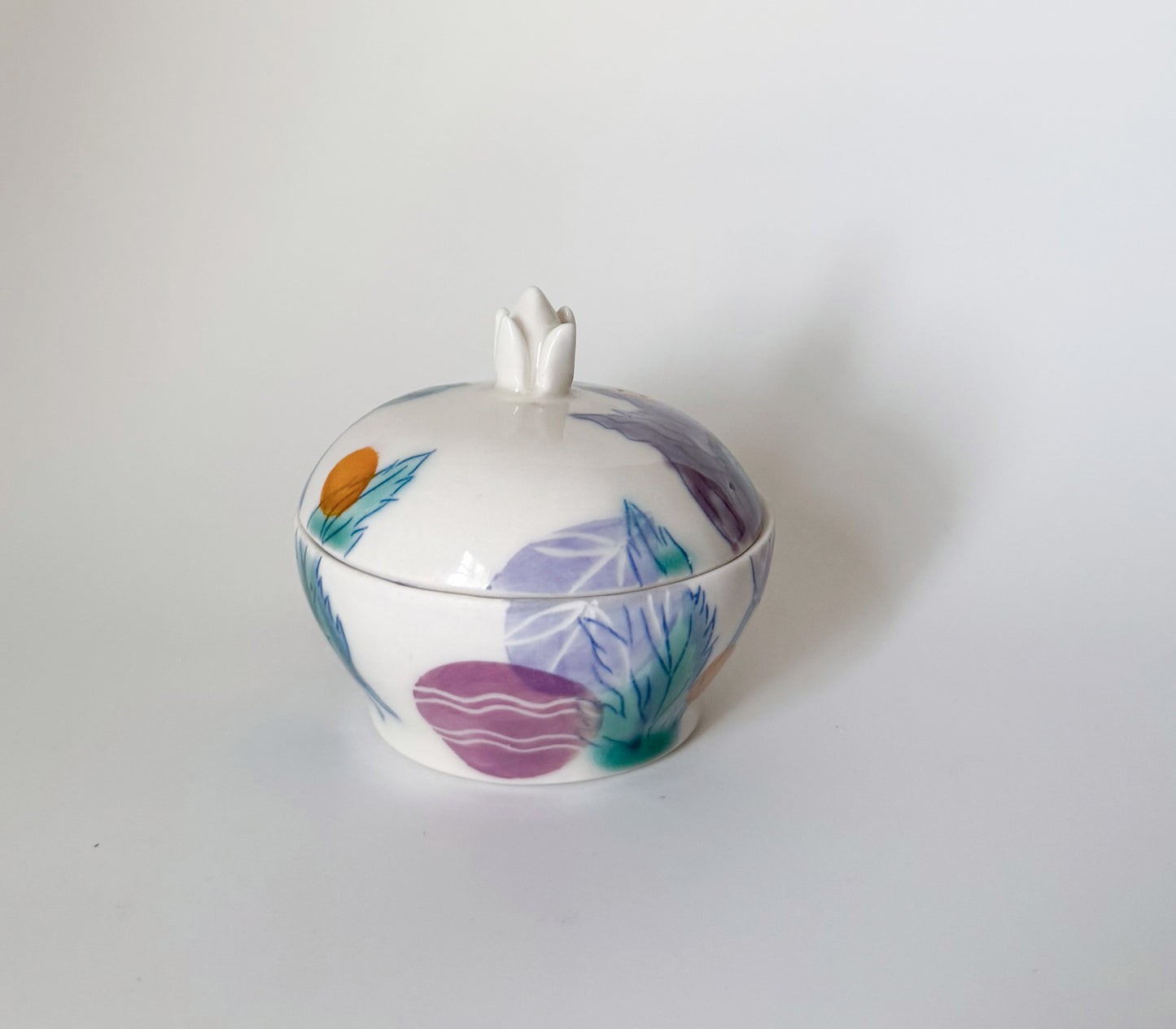 Lidded jar with clematis