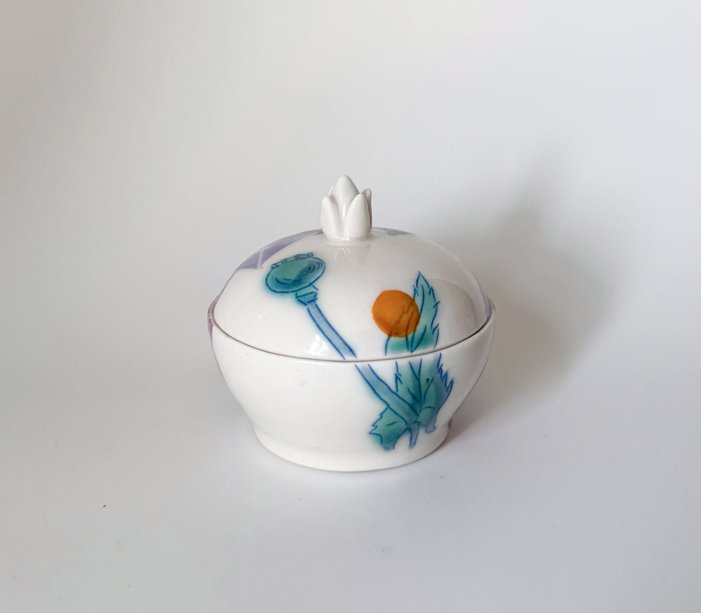 Lidded jar with clematis