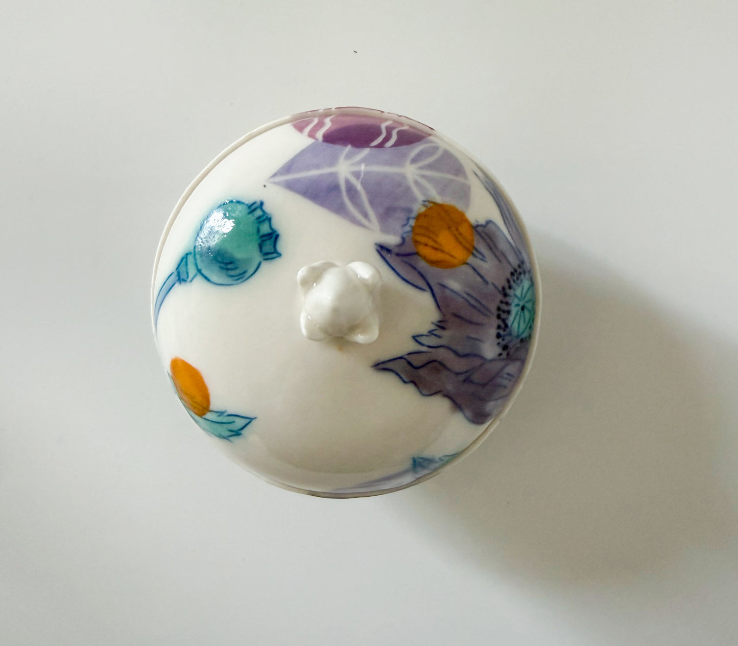 Lidded jar with clematis