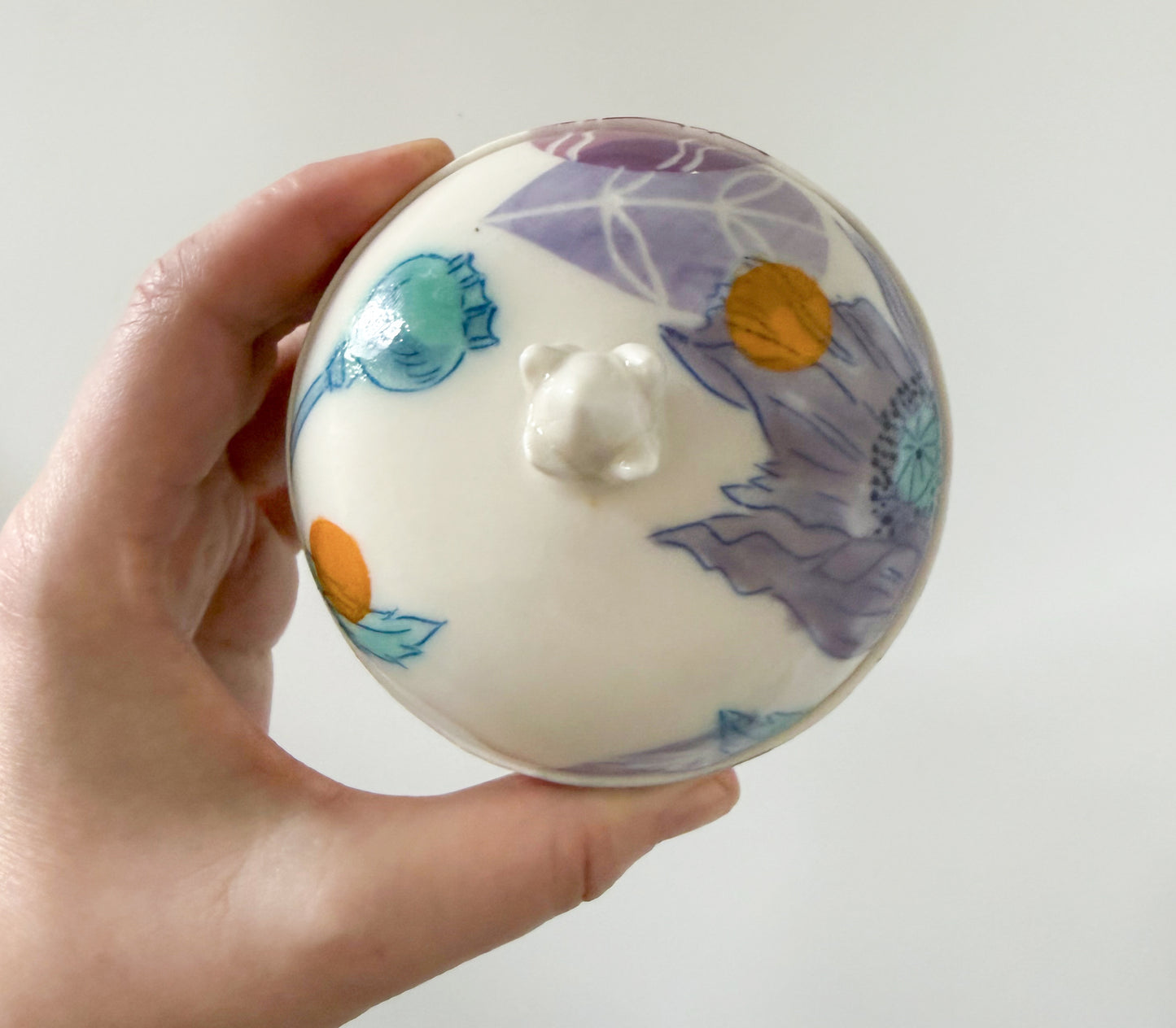 Lidded jar with clematis