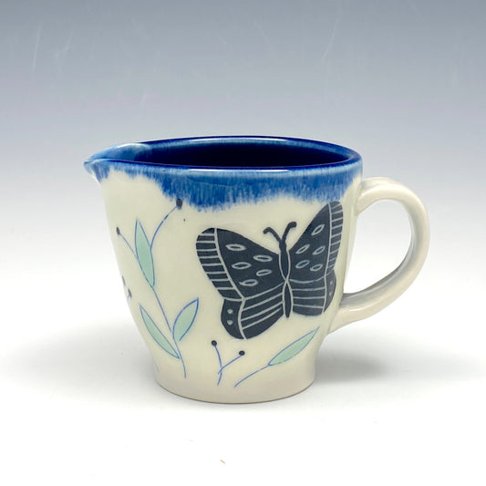 Creamer with black butterflies